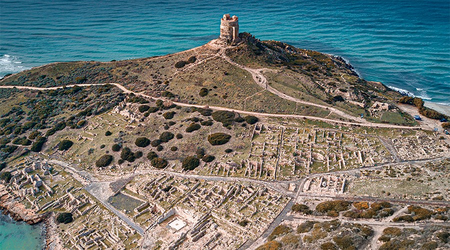 An aerial view of Tharros and the Mediterranean Sea on the western coast of Sardinia. An aerial view of Tharros and the Mediterranean Sea on the western coast of Sardinia.