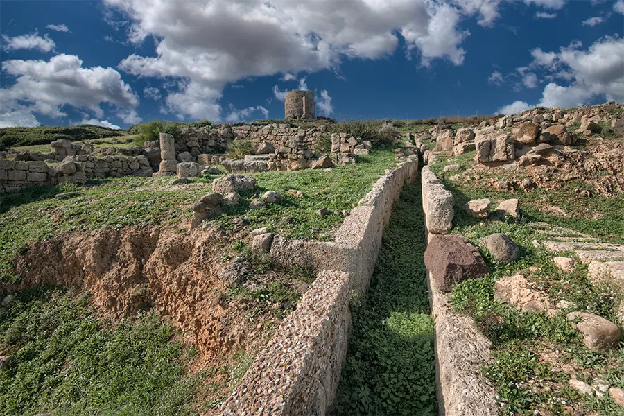 A water canal running through Tharros.