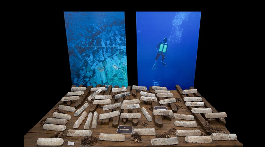 Hundreds of ingots from the wreck of a Roman-era vessel are now in a museum in nearby Cabras, along with photos of underwater archaeologists at work. Hundreds of ingots from the wreck of a Roman-era vessel are now in a museum in nearby Cabras, along with photos of underwater archaeologists at work.