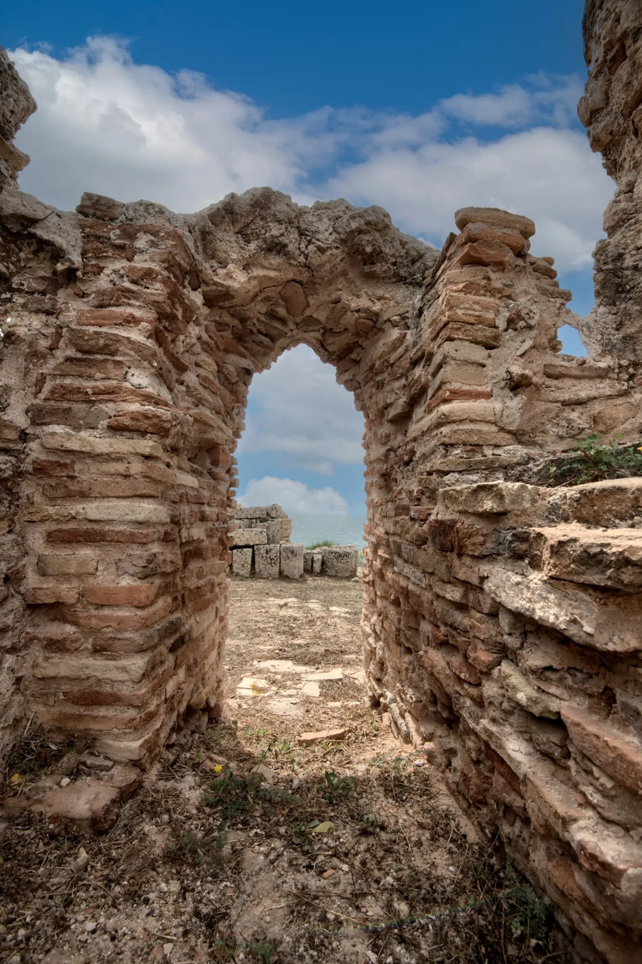 A pointed doorway from the furnace (praefurnium) in a bath complex.